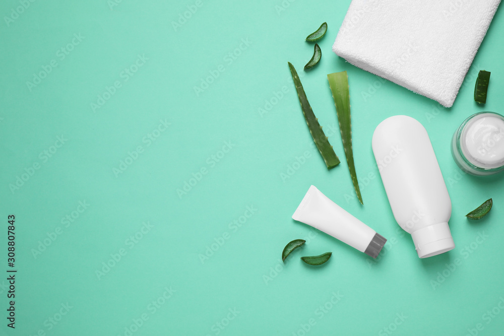 Flat lay composition with aloe vera and cosmetic products on turquoise background. Space for text Flat lay composition with aloe vera and cosmetic products on turquoise background. Space for text