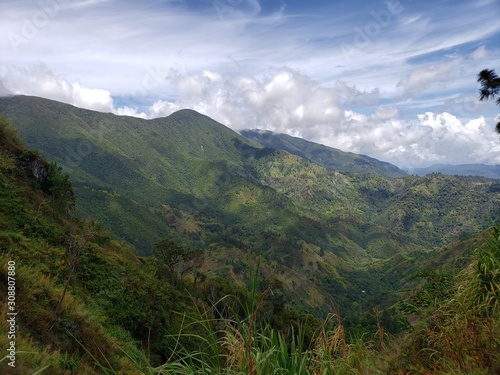 Blue Mountain range with clouds in the sky. Interlocking hills