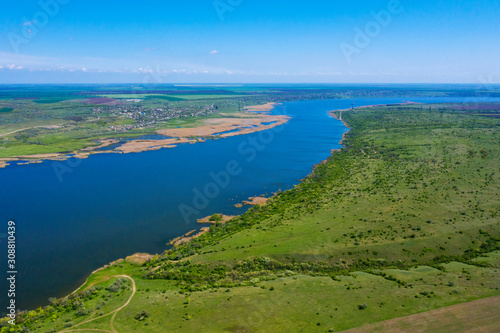 Drone shot aerial view scenic landscape a big river against a blue sky