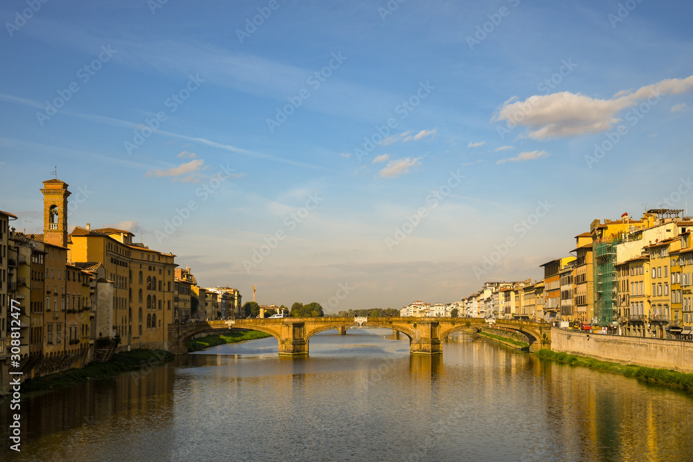 Scenic view of the Arno River with the Ponte Santa Trinità bridge and the bell tower of the Basilica of Santo Spirito in the historic centre of Florence, Unesco World Heritage Site, Tuscany, Italy