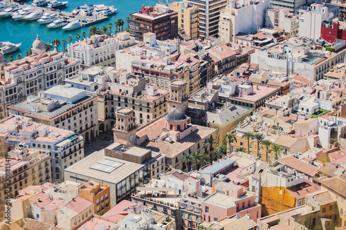 Beautiful wide aerial view of Alicante, Valencian Community, Spain with port of Alicante, beach and marina, with mountains and skyline, seen from Santa Barbara Castle on Mount Benacantil, sunny day