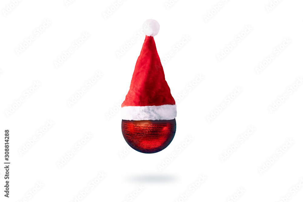 christmas red ball in santa claus hat over white background, merry christmas concept christmas red ball in santa claus hat over white background, merry christmas concept