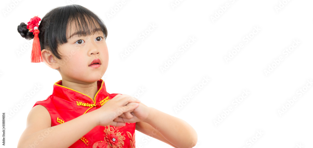 A picture of an Asian girl wearing a red Chinese dress in a white background. Concept Chinese new year for the love day and is a tradition in China every year. A picture of an Asian girl wearing a red Chinese dress in a white background. Concept Chinese new year for the love day and is a tradition in China every year.