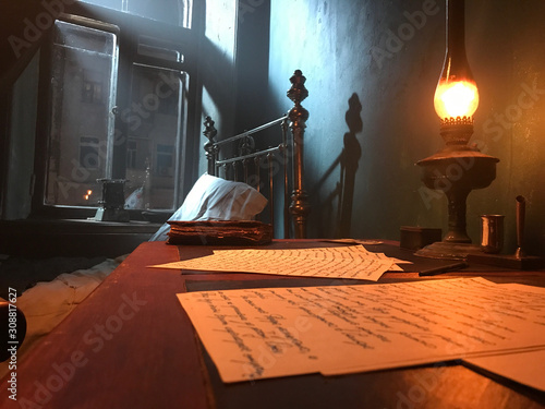 Foto manuscripts under the light of the 19th Century Antique kerosene lamp, a mysteri