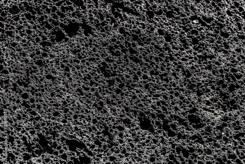 Volcanic rock relief structure lava background texture.