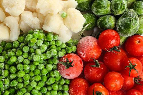 Fototapeta Naklejka Na Ścianę i Meble -  Different frozen vegetables as background, top view