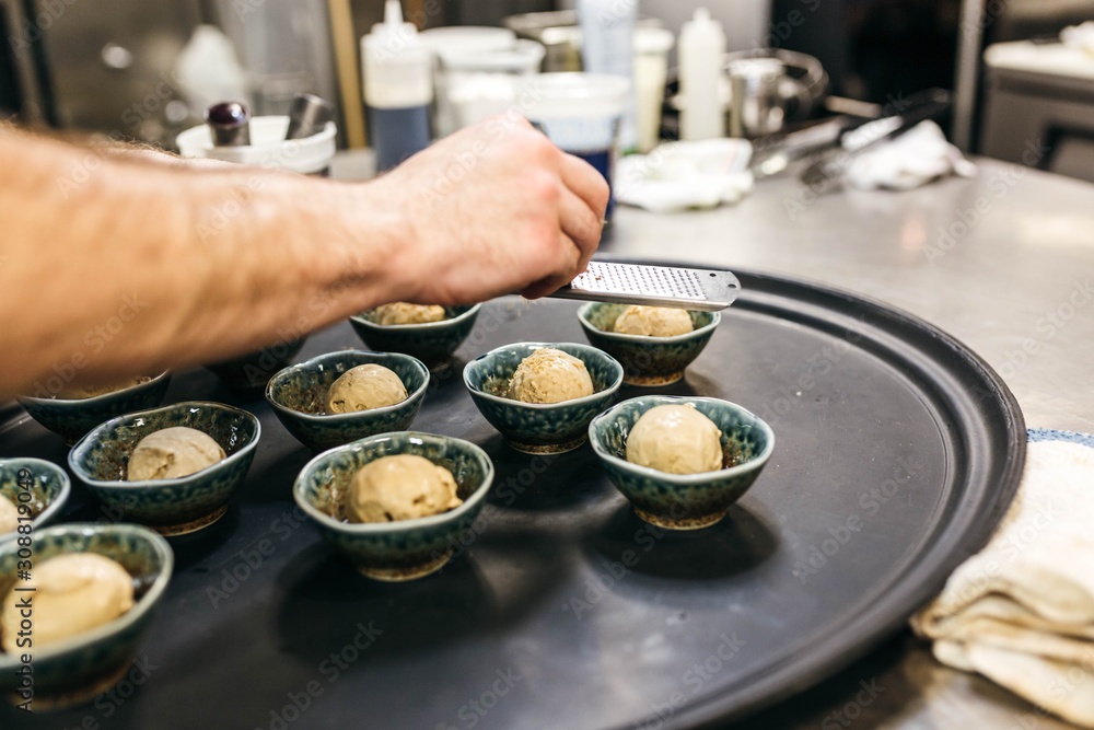 Chef preparing brown sugar ice cream with candied chestnut Chef preparing brown sugar ice cream with candied chestnut