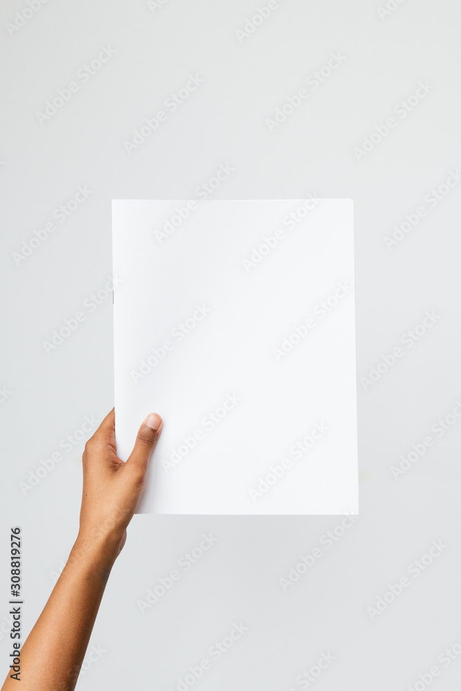 Ethnic model holding a letter size or A4 brochure mockup Ethnic model holding a letter size or A4 brochure mockup