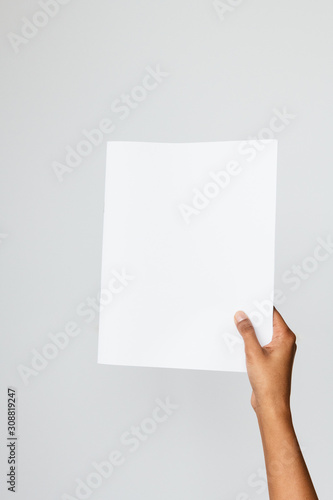 Ethnic model holding a letter size or A4 brochure mockup