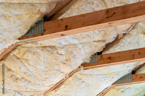 Glass mineral wool insulation in between roof rafters.