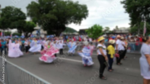Blurred video of traditional young Panamanian dancers in the street at Panama National Day parade celebrating the separation of Panama from Colombia Nov 3rd. 4K, full HD video. photo