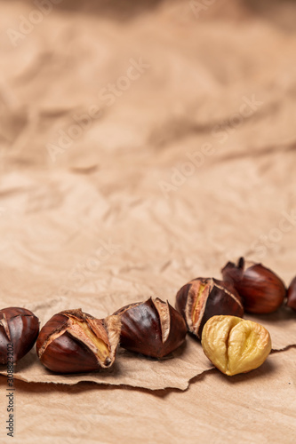 Roasted chestnuts on paper background