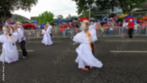 Blurred video of traditional young Panamanian dancers in the street at Panama National Day parade celebrating the separation of Panama from Colombia Nov 3rd. 4K, full HD video.