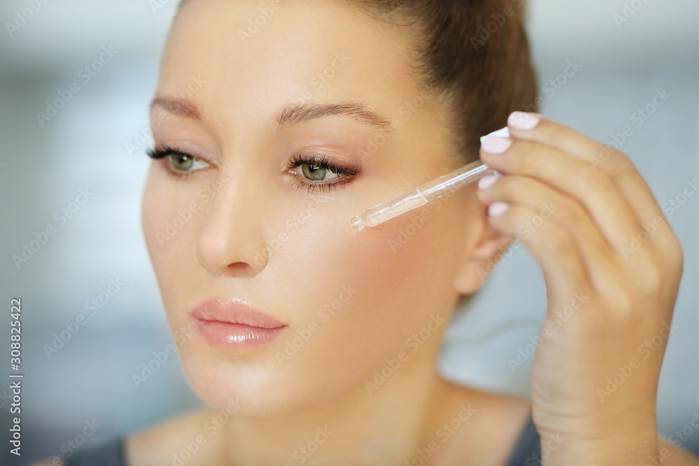 Magic anti-aging cream.Applying the cream Magic anti-aging cream.Applying the cream