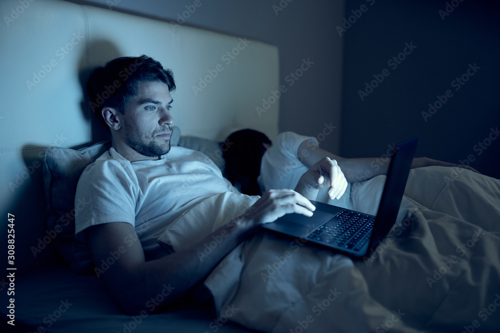 Fototapeta premium man sitting on sofa and watching tv
