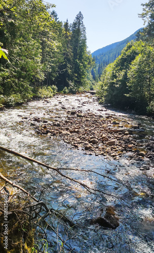 Shimmering cascades and bountiful boulders on the North Fork Sauk River in the Summertime off the Mountain Loop Highway in Silverton Washington State Snohomish County photo