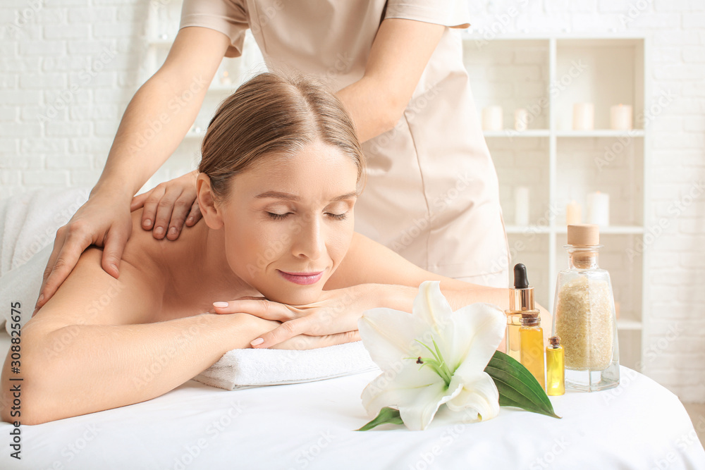 Beautiful woman receiving massage in spa salon Beautiful woman receiving massage in spa salon