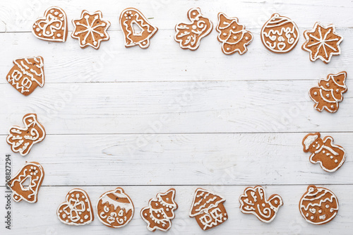 Christmas gingerbread handmade on a white wooden background. A look from above. New Year's concept.