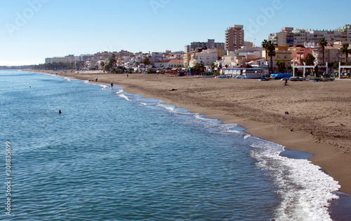 Spain,  Carihuela beach, on the Costa del Sol at Torremolinos. A sunny winters day. Crisp, bright sunshine. photo