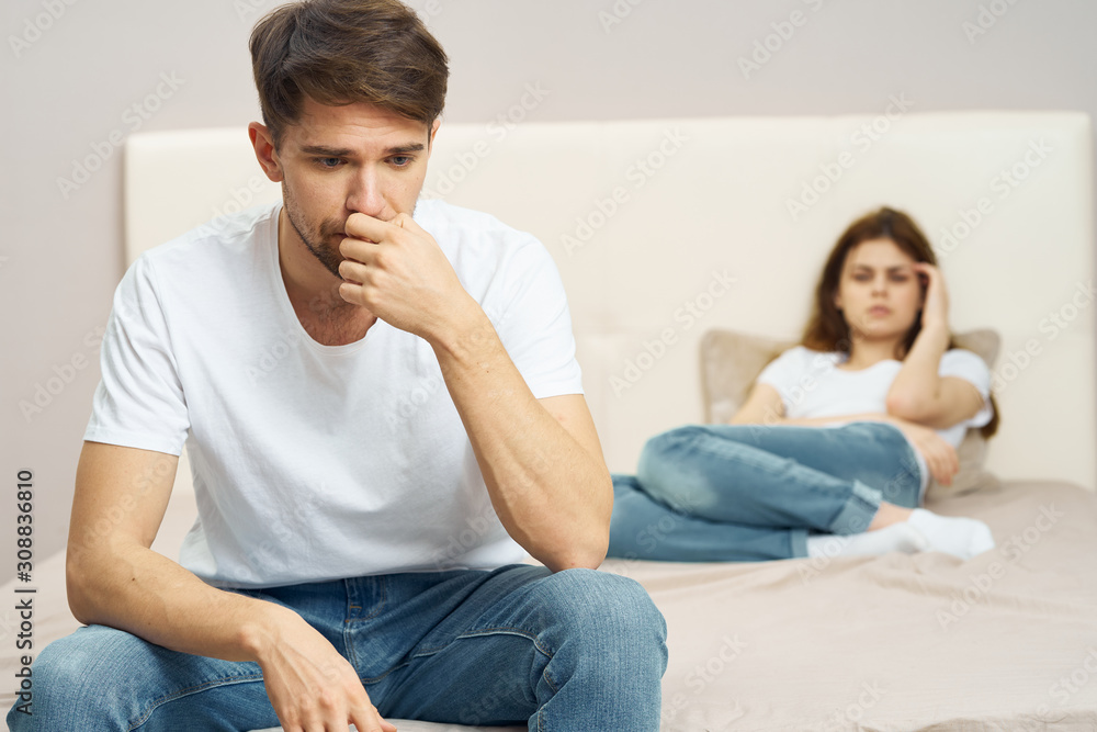 couple sitting on sofa and watching tv