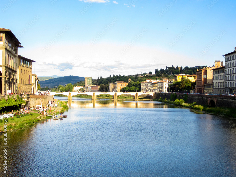 Beautiful view of the Ponte alle Grazie spanning across the Arno River in Florence, Italy.