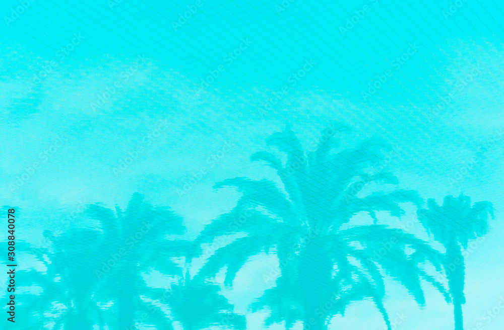 inverted reflection of palm trees in the pool toned in color Aqua Menthe