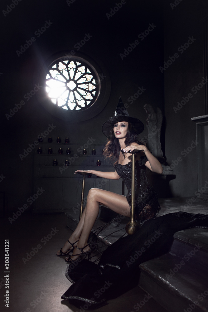 Sexy witch with long legs. Stock Photo | Adobe Stock
