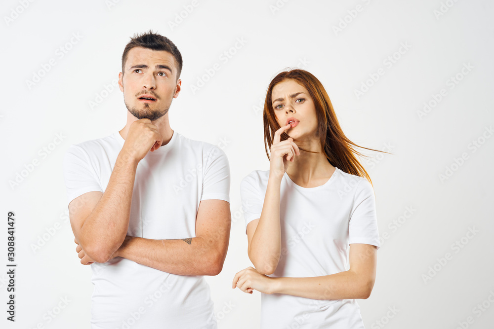 young couple in t-shirts chatting young couple in t-shirts chatting