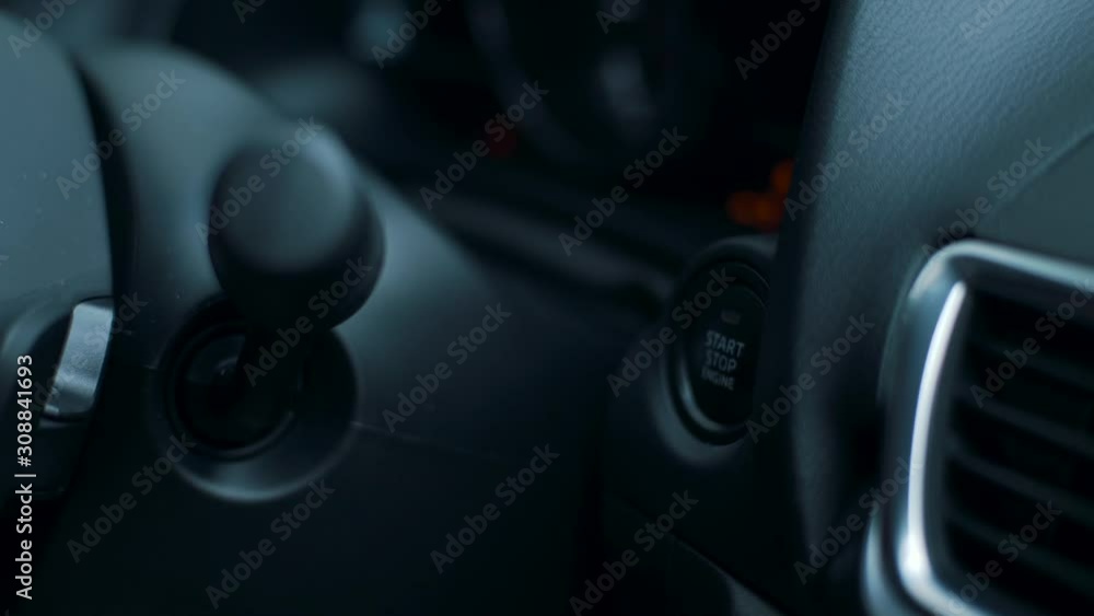 girl presses a start engine button close-up girl presses a start engine button close-up