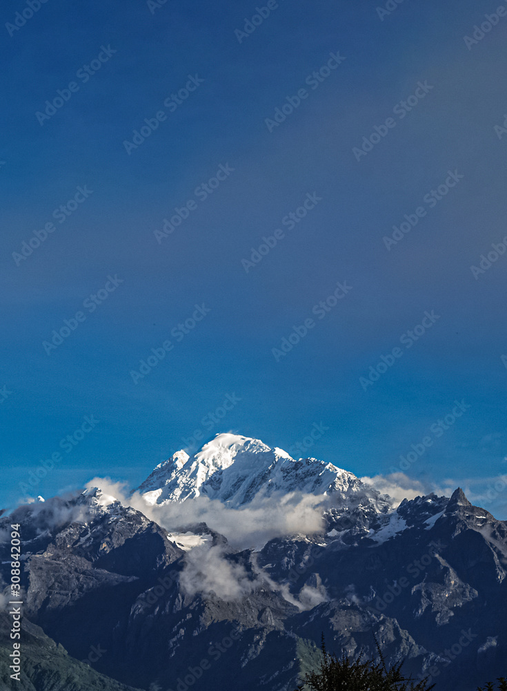Beautiful Shot of a Snowy Mountain With Clear Blue Sky