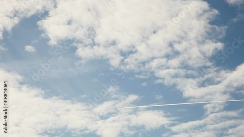 View of geoengineered cloud cover that is highly reflective. A dark chemtrail is seen at the beginning of the clip and white trails show on the other side of the sky, along with those that have spread