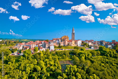 Old stone town of Buje on green hill aerial view