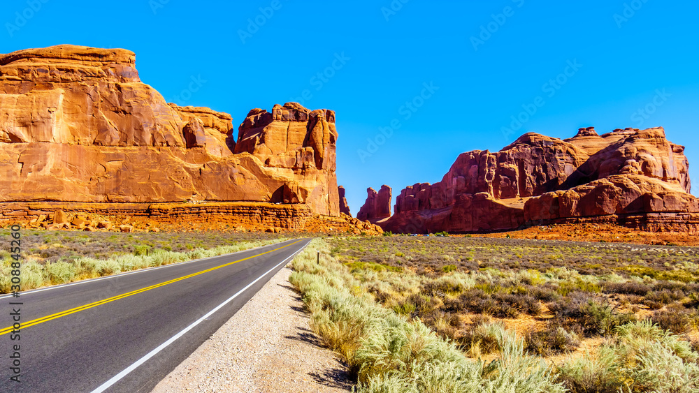 Tall and fragile sandstone Rock Pinnacles along Arches Scenic Drive in the desert landscape of Arches National Park near Moab in Utah, United States Tall and fragile sandstone Rock Pinnacles along Arches Scenic Drive in the desert landscape of Arches National Park near Moab in Utah, United States