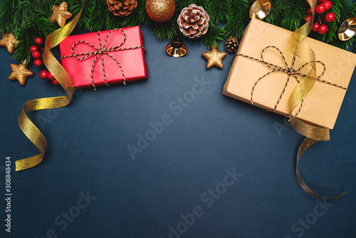 Christmas present and pine tree with xmas decoration on blue background