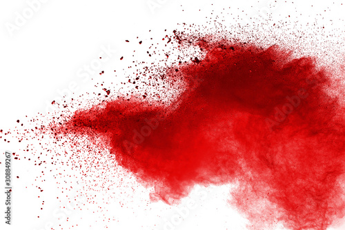 Red powder explosion on white background. Colored cloud. Colorful dust explode. Paint Holi.