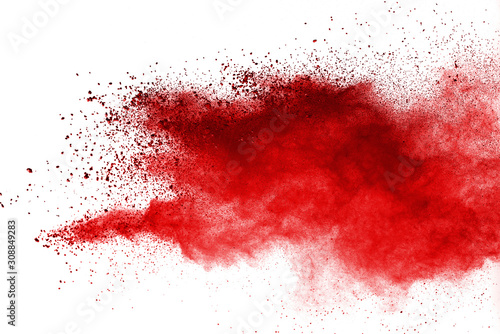 Red powder explosion on white background. Colored cloud. Colorful dust explode. Paint Holi.