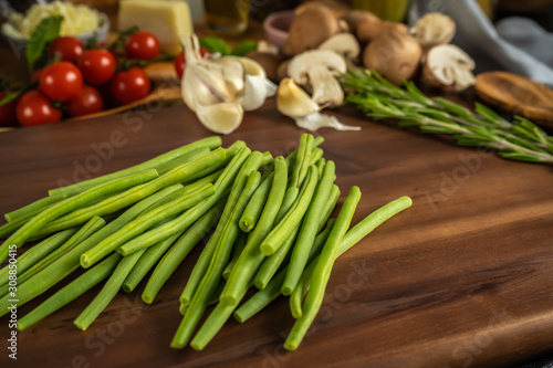 Green beans on a wooden board