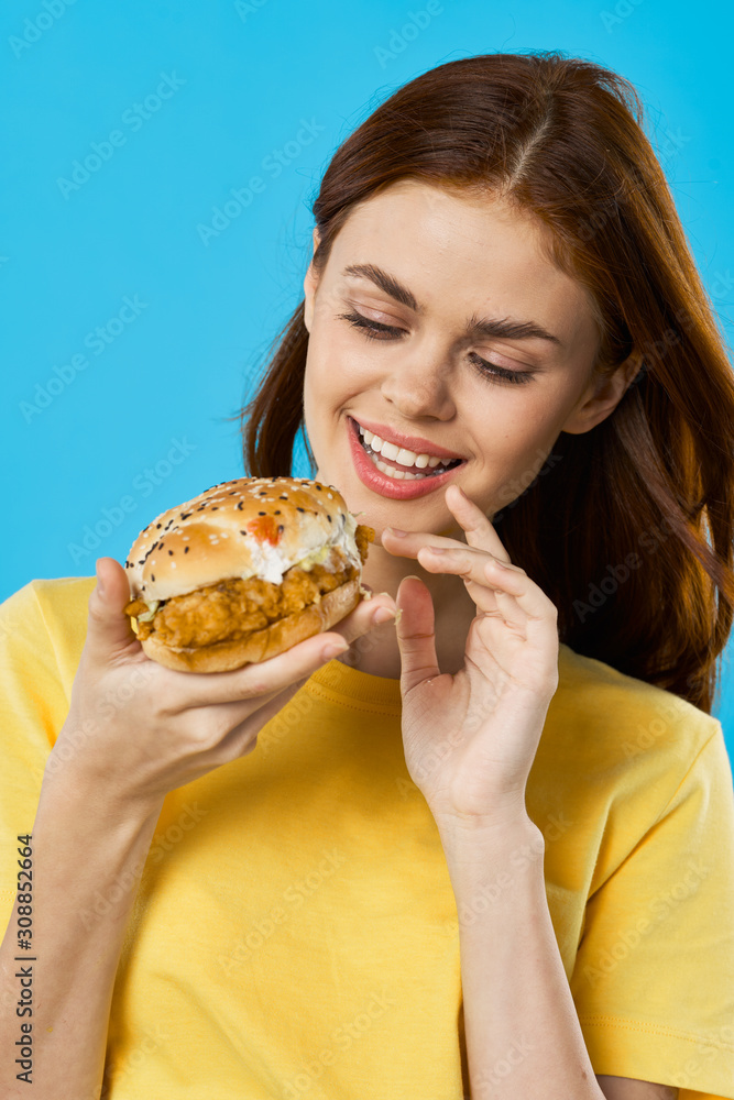 woman eating hamburger