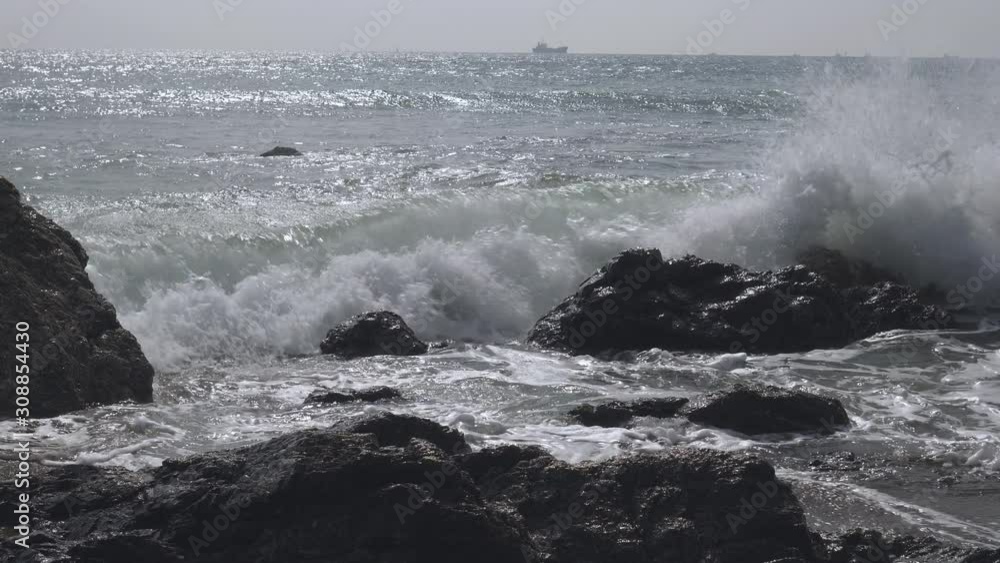 View of the waves and the rocks in Koijigahama Beach