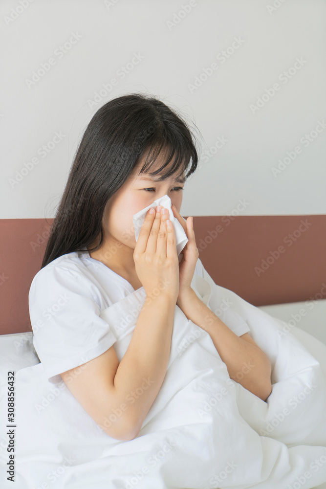 asian young woman get cold in bedroom, sneeze asian young woman get cold in bedroom, sneeze
