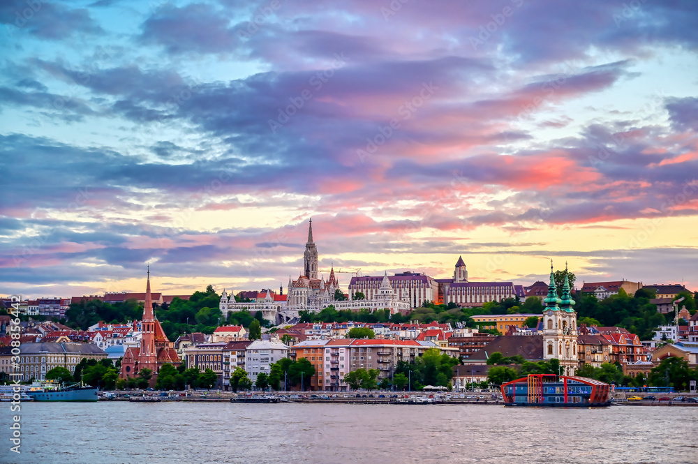 Fototapeta premium The Buda side of Budapest, Hungary along the Danube River at sunset.