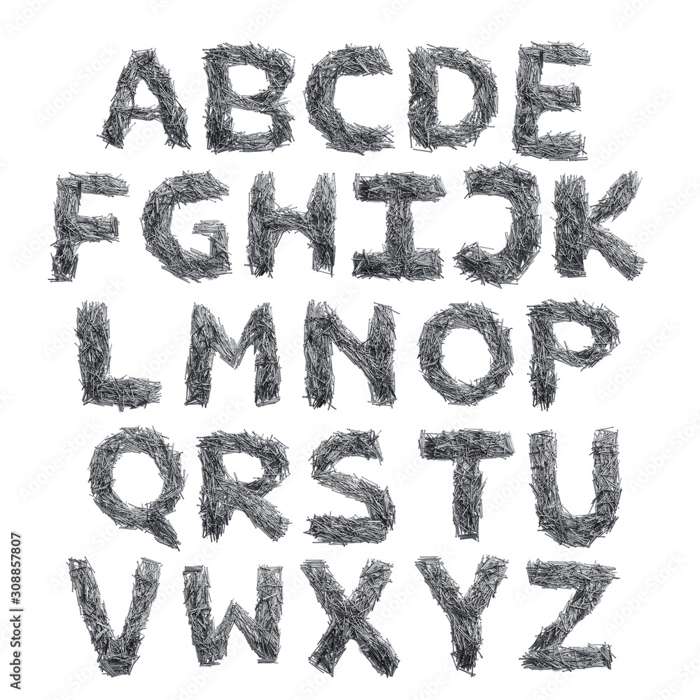 English alphabet from small iron nails on a white isolated background. Industrial pattern of thin nails for fasteners. bright numeral for design. English alphabet from small iron nails on a white isolated background. Industrial pattern of thin nails for fasteners. bright numeral for design.