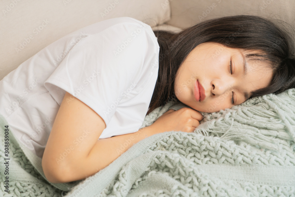 asian young woman sleeping on sofa asian young woman sleeping on sofa