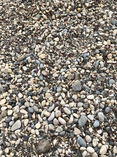 Sea pebbles. Abstract background of sea pebbles. Selective focus.