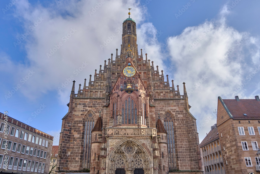 Fototapeta premium Scenic view of Church of Our Lady (Frauenkirche) - Roman Catholic Parish church in Nuremberg in Bavaria in Germany. Beautiful summer sunny look of old gothic christian temple in ancient city in Europe