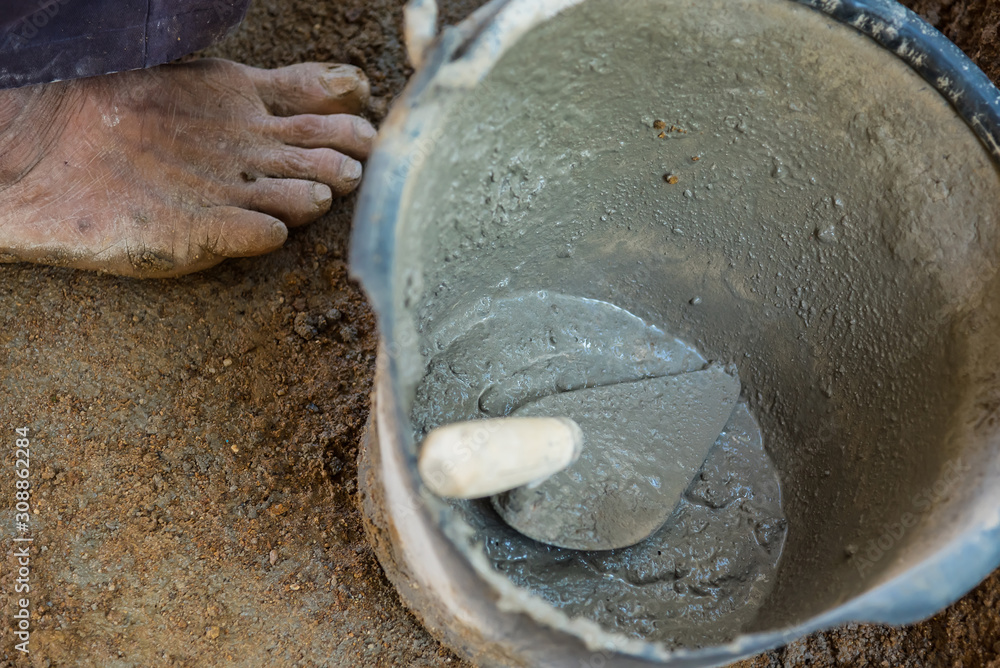 Pick up a trowel and cement mix concrete is compacted sand. Stock Photo by  ©Bubbers 325059608