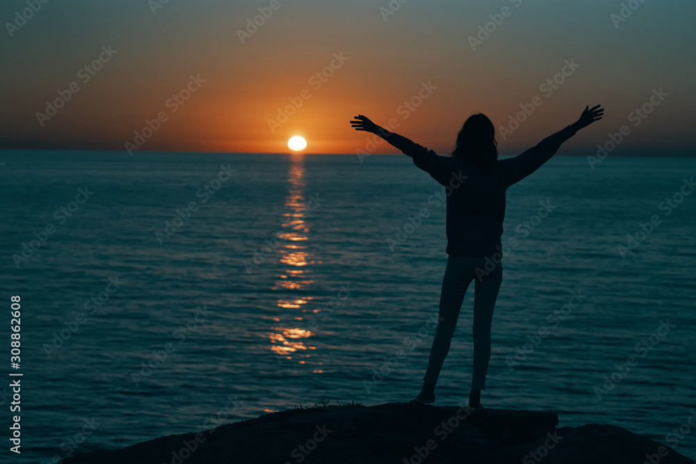 silhouette of woman on the beach