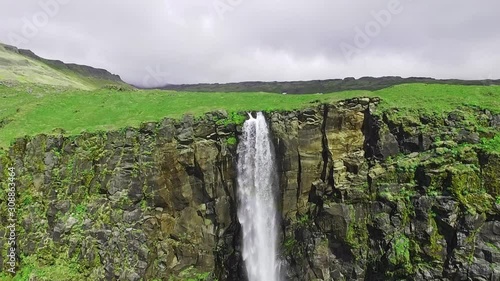 Aerial close up of Bjarnafoss Waterfall in Iceland, on the Snaefellsnes peninsula. Drone flying over Iceland. photo