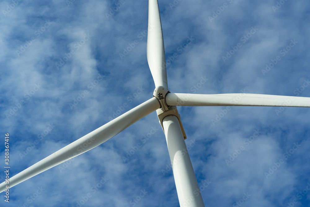 wind turbine and blue sky background. concept clean energy power in nature wind turbine and blue sky background. concept clean energy power in nature