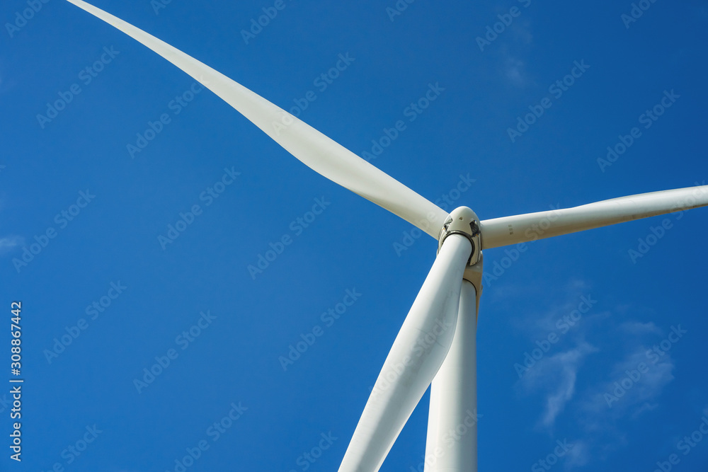 wind turbine and blue sky background. concept clean energy power in nature wind turbine and blue sky background. concept clean energy power in nature